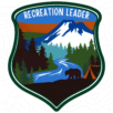 Recreation Leader logo featuring a scenic shield design with a river, mountain, forest, a bear, and a campsite, symbolizing outdoor recreation and stewardship.